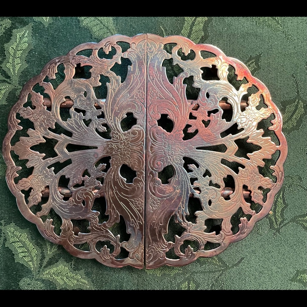 Silver plated adjustable trivet.